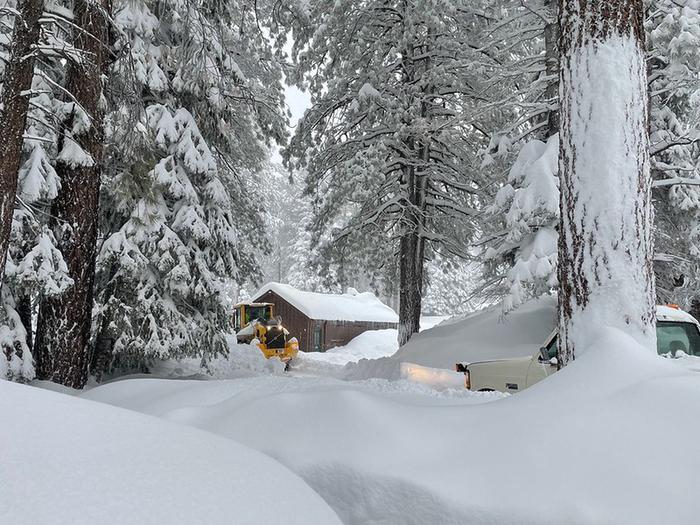 Heavy equipment plow through several feet of snowThe North Rim can receive several feet of snow during the winter and could delay the opening of the park in the spring