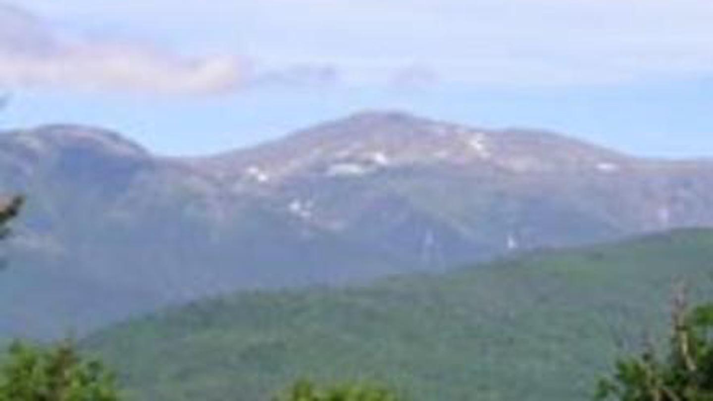 A mountain range with pockets of snow on its peaksScenery near Doublehead Cabin