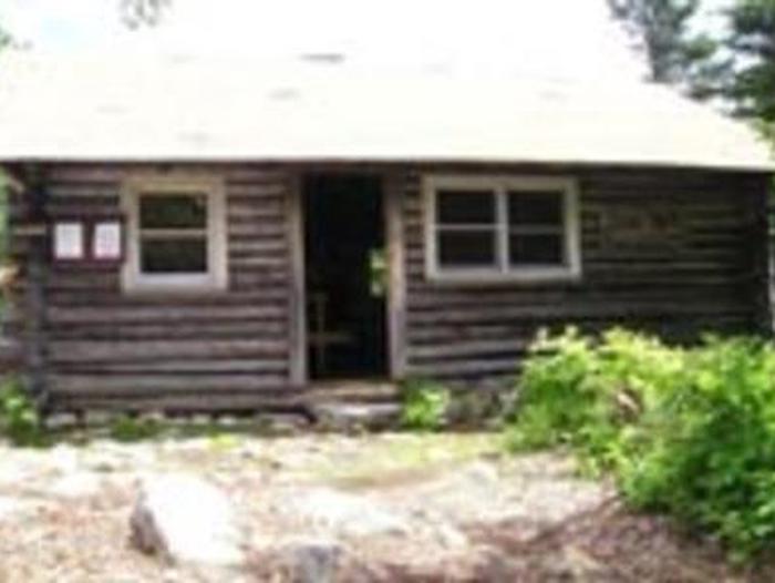 Exterior of a small wooden cabinDoublehead Cabin