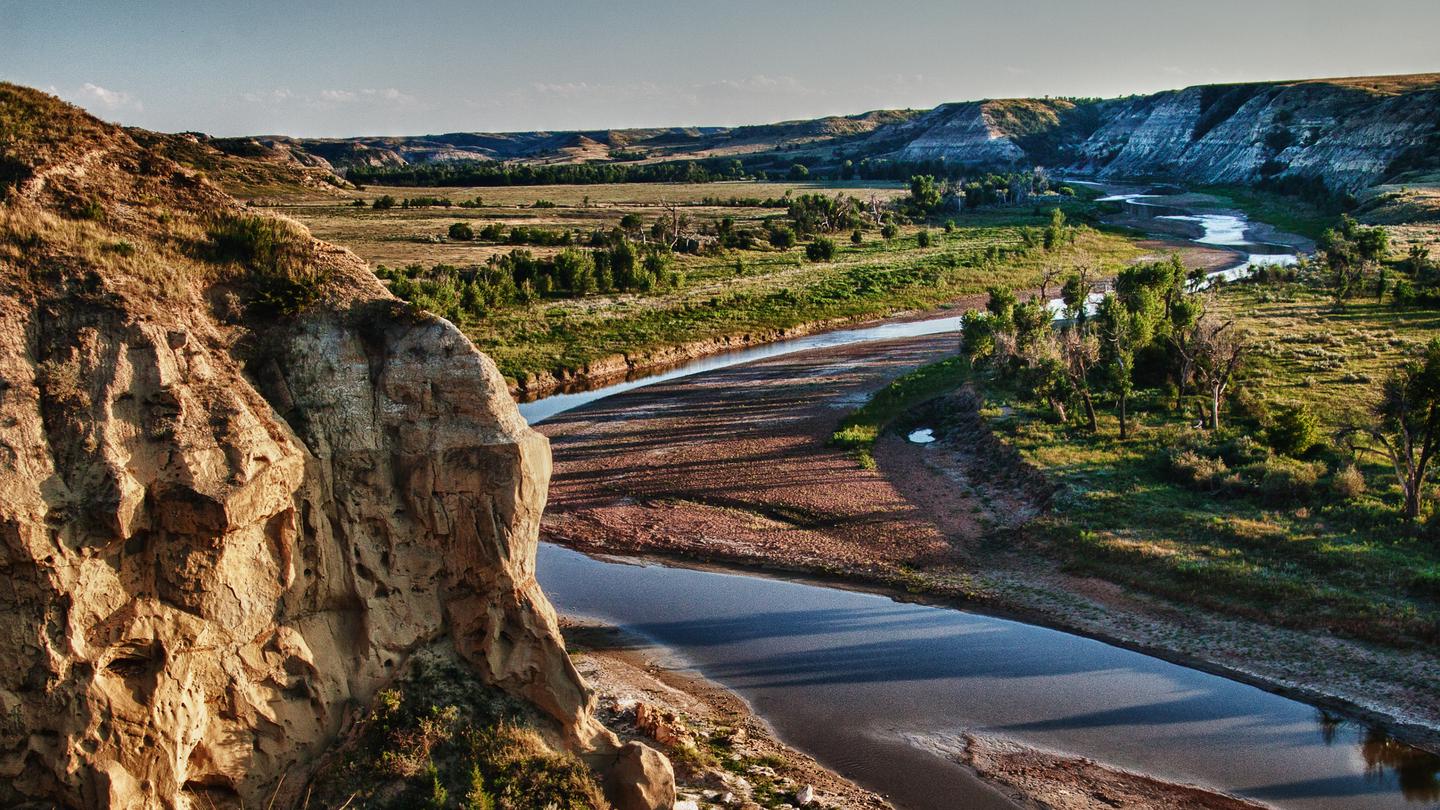 A panoramic view of the Little Missouri River winding through Wind Canyon 