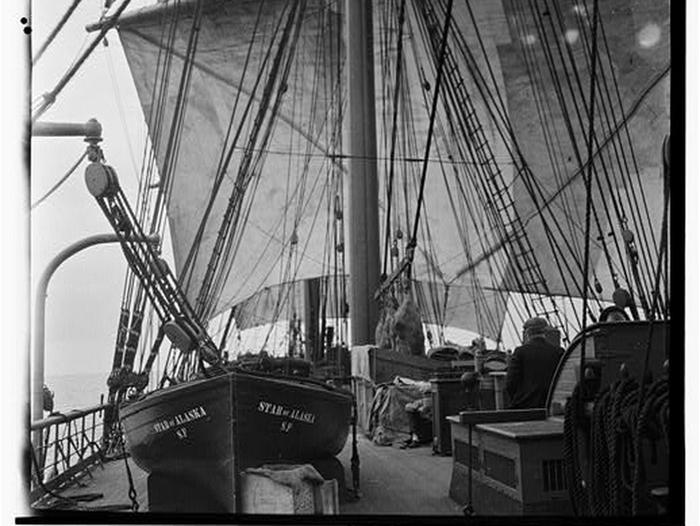 Deck view of Star of Alaska with lifeboat and sailsStar of Alaska under sail