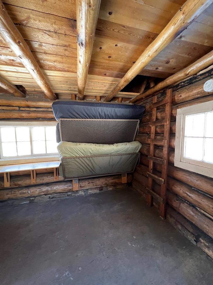 Log cabin with fold up bunk bedsBunk Beds