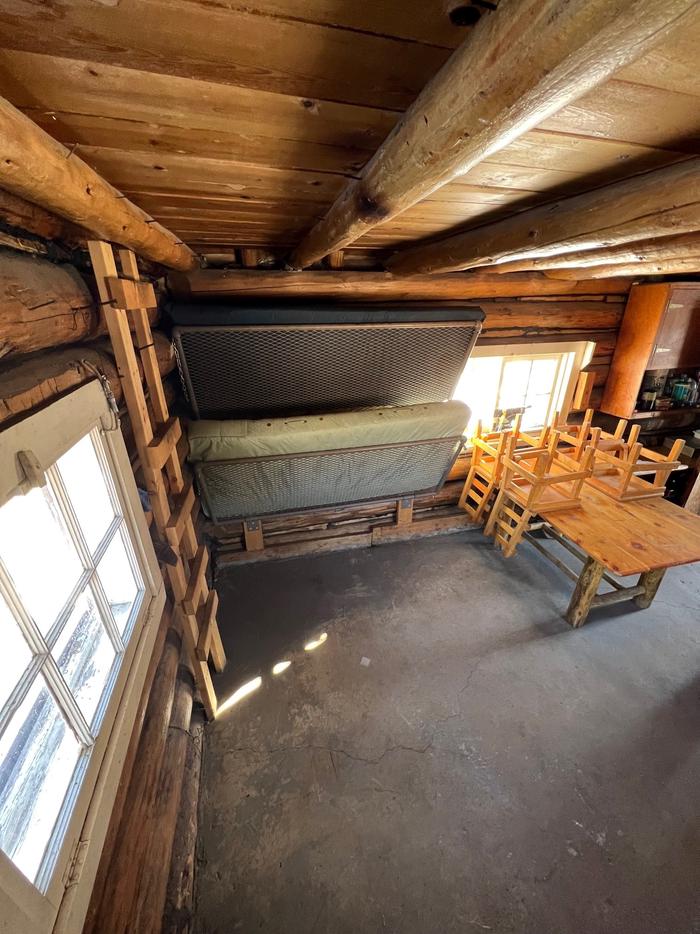 Folding Bunk beds inside of a log cabinBunk beds