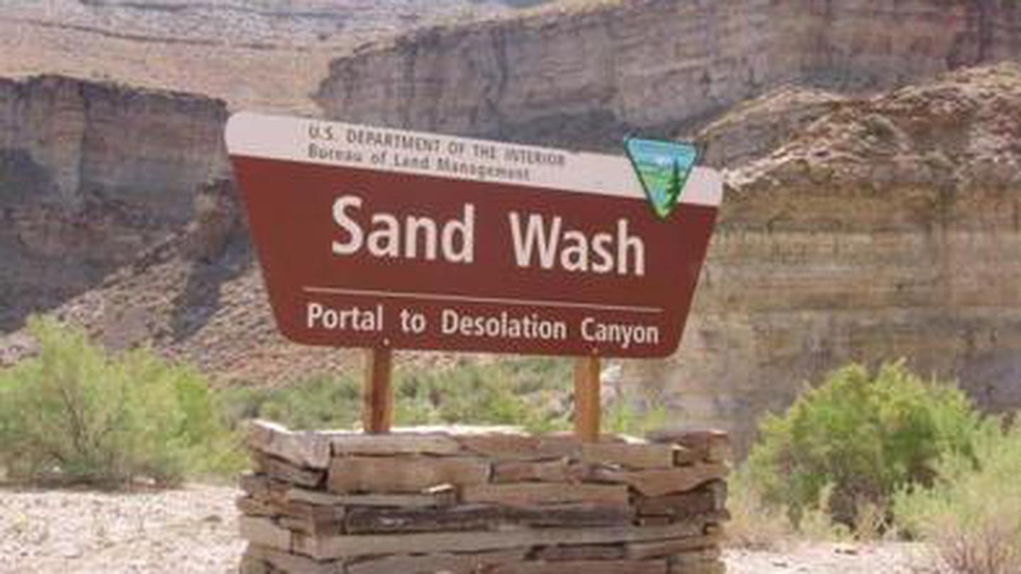 Bureau of Land Management brown portal sign for Sand Wash Portal to Desolation CanyonDESOLATION GRAY CANYONS SCREEN CABINS