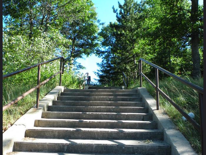 Looking up a flight of stairs from the Kneff Lake Day Use Area. 