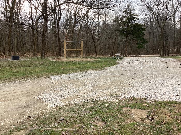 A photo of Site 9 of Loop Hickory Ridge Campground at Hickory Ridge Campground with Picnic Table, Fire Pit, and Hitching Post.