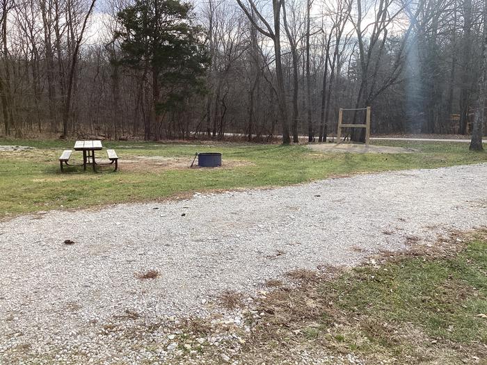A photo of Site 10 of Loop Hickory Ridge Campground at Hickory Ridge Campground with Picnic Table, Fire Pit, Pull-through Parking, and Hitching Post.