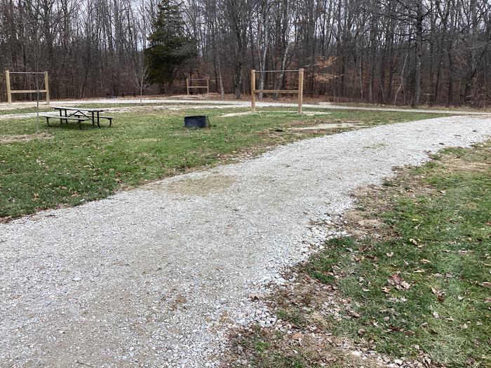 A photo of Site 4 of Loop Hickory Ridge Campground at Hickory Ridge Campground with Picnic Table, Fire Pit, Hitching Post, and Pull-through Parking.