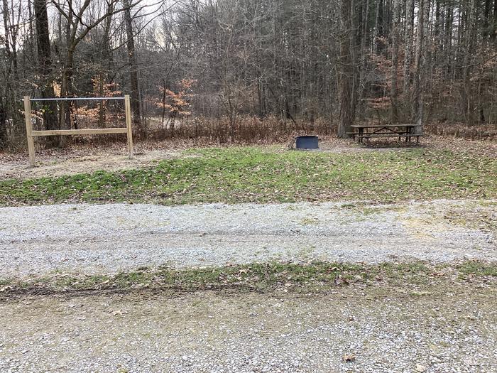 A photo of Site 1 of Loop Hickory Ridge Campground at Hickory Ridge Campground with Picnic Table, Fire Pit, Shade, Hitching Post, and Pull-through Parking.