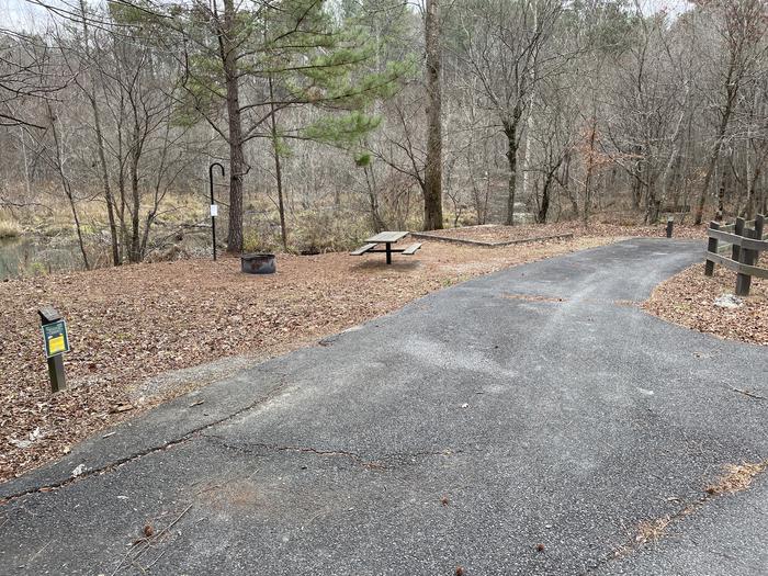 Site 1 entranceA photo of Site 1 of Loop main at Pocket Campground with Picnic Table, Fire Pit, Tent Pad, Lantern Pole