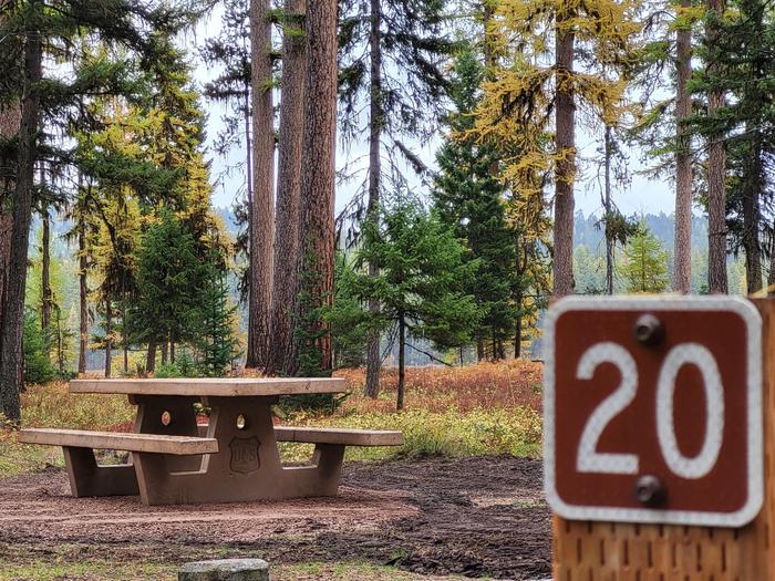 A photo of Site SLS20 in Loop 2 at Seeley Lake Lolo Campground (MT) with campsite marker, picnic table. A photo of Site SLS20 in Loop 2 at Seeley Lake Lolo Campground (MT) with campsite marker, picnic table.