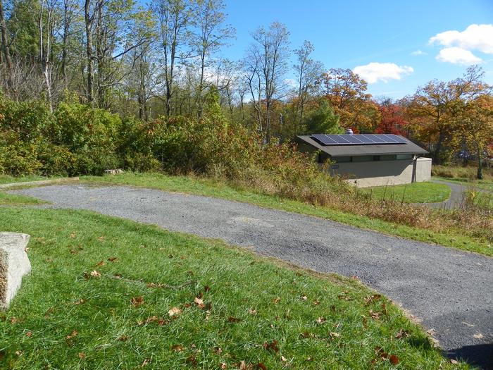 A62 - close to restroomSite has a driveway, tent pad, picnic table, and fire pit. 