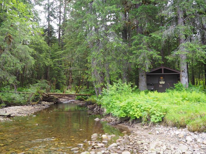 Eagle Lake Cabin with stream on side surrounded by treesEagle Lake Cabin