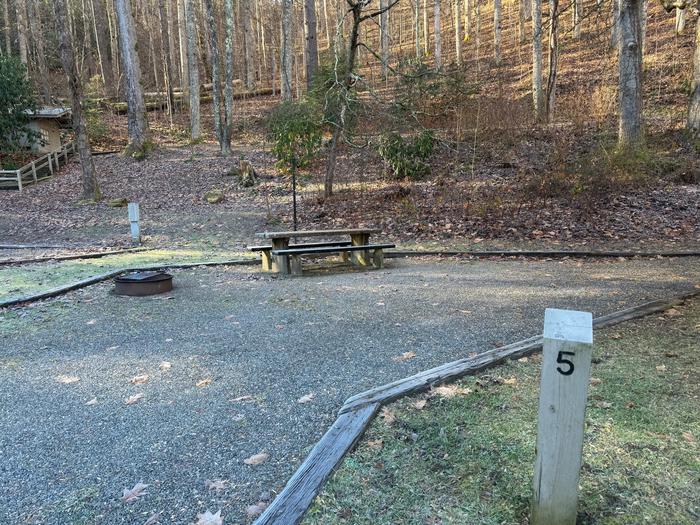 Site 5 includes a picnic table and fire ring. Site 5 has a picnic table and fire ring. Flush toilet restrooms available on site. 