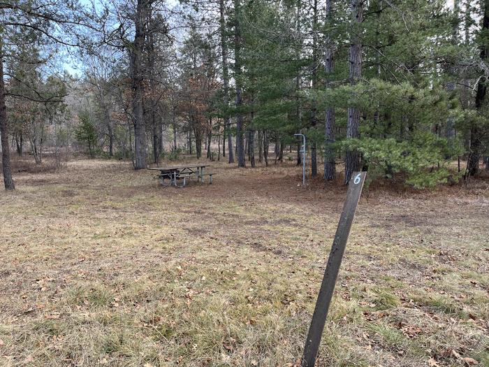 A photo of Site 6 of Loop  at Meadows ORV Campground with Picnic Table, Fire Pit, Lantern Pole