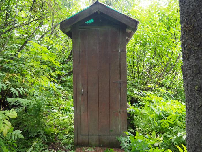 Sergief Island Cabin outhouse surrounding by greenerySergief Island Cabin outhouse