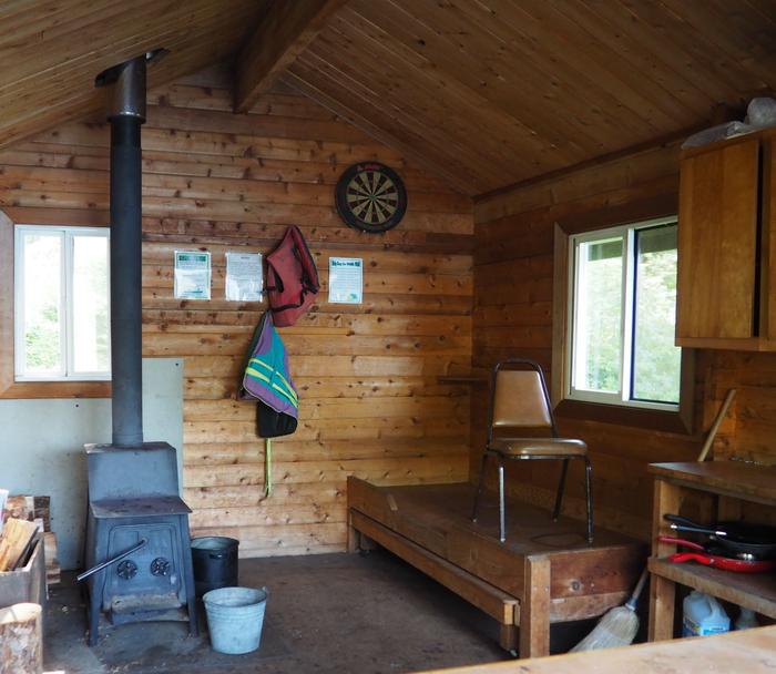 Virginia Lake Cabin interior showing wood bunk and stoveVirginia Lake Cabin interior