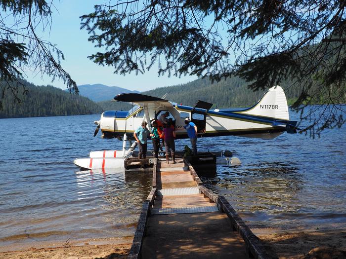 Four people getting on floatplane on Virginia LakeGetting on floatplane at Virginia Lake Cabin