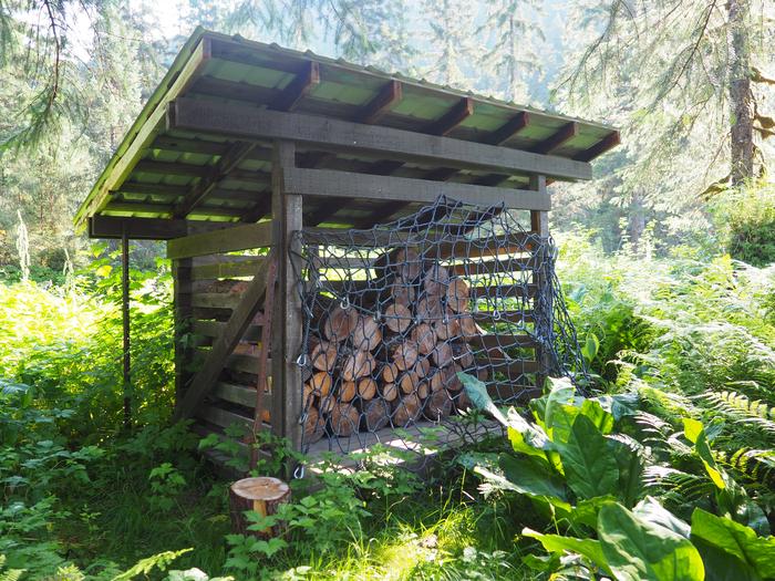 Wood shed amongst greeneryWoodshed at Marten Lake Cabin
