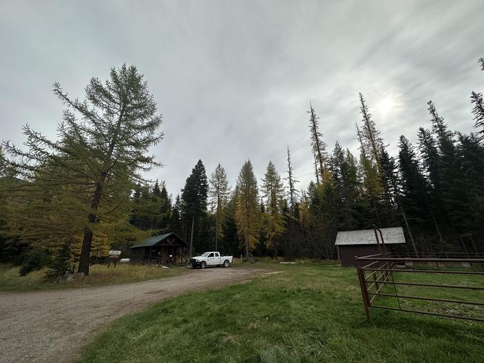 Owl Creek cabin in fall. With a rental corral next to it.