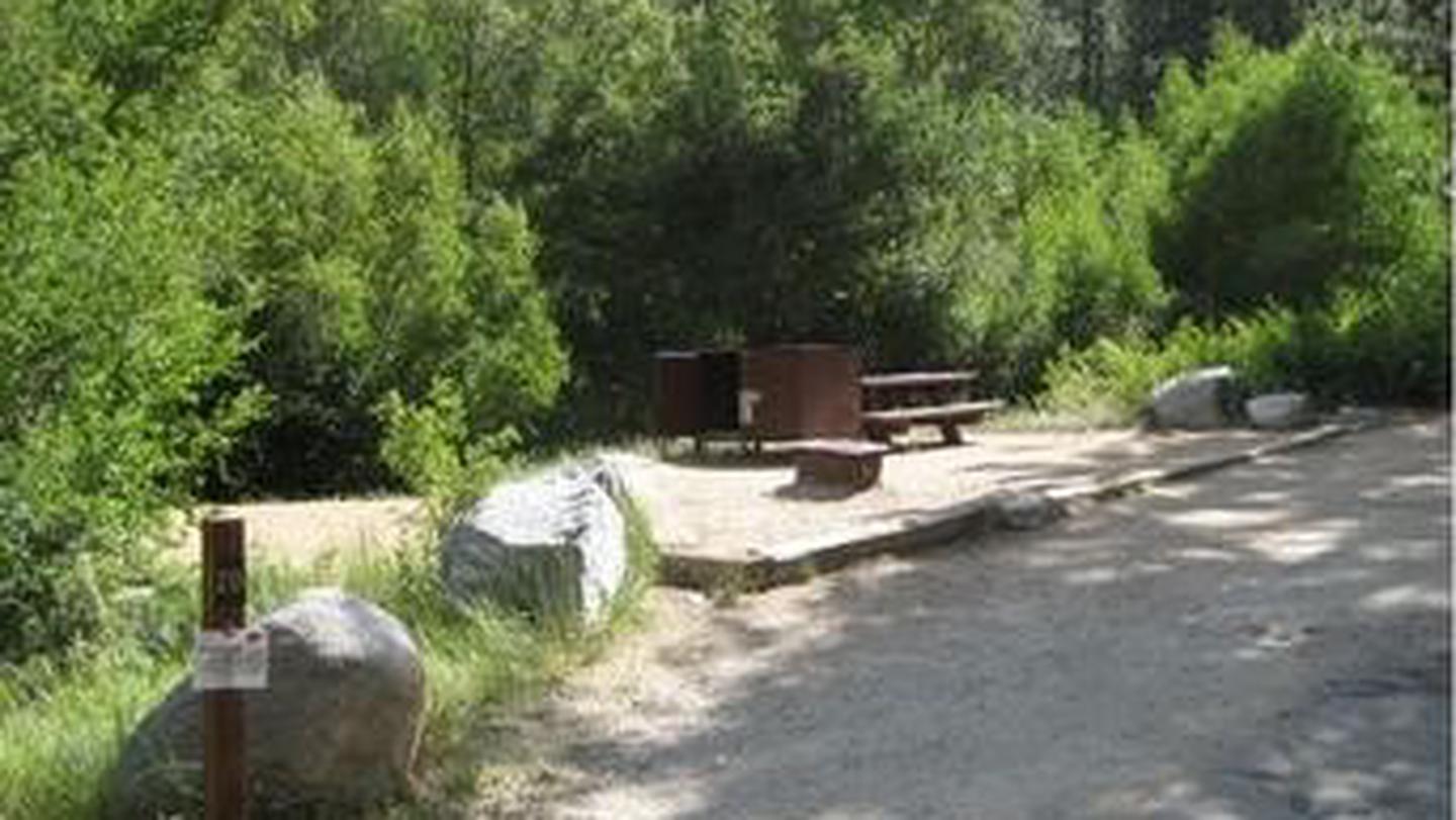 Large boulders frame a campsite in the forestBig Pine Creek Campground