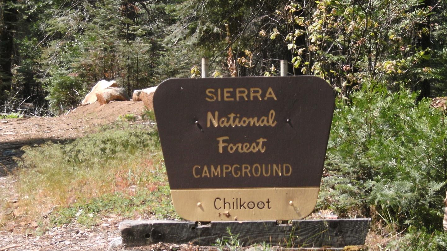 A brown and yellow Forest Sign for Chilkoot Campground on the Sierra National ForestEntry Sign