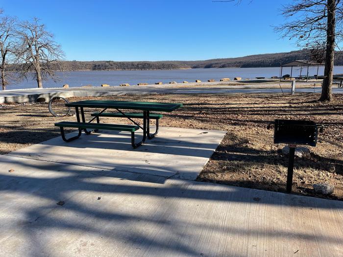Site 18Site 18 has some shade, picnic table, grill, fire ring, water and electric hookups