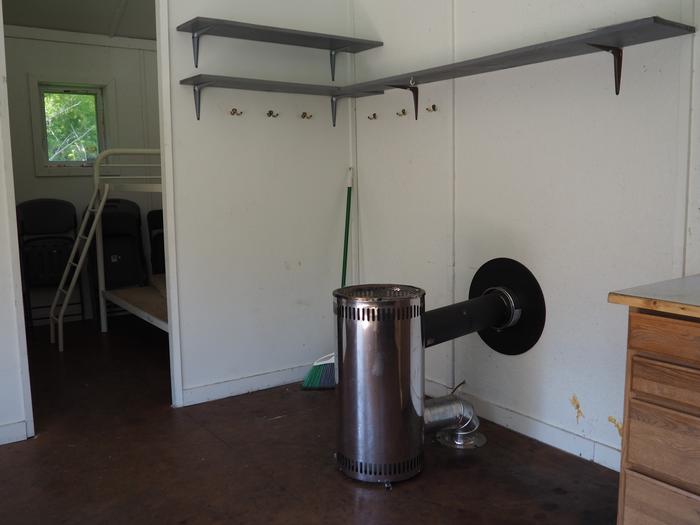 Deep Bay Cabin stove and shelvesDeep Bay Cabin interior