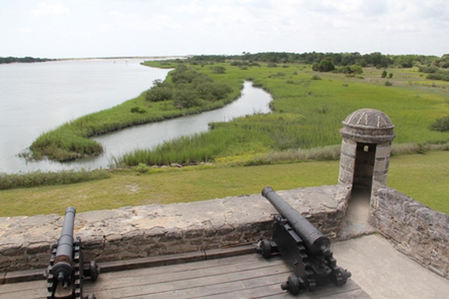 Fort Matanzas Gun DeckView from the gun deck of Fort Matanzas.  Cannons facing south in the foreground with the Matanzas Inlet in the background.  