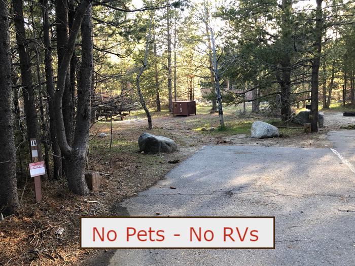 A Photo of campsite S14 showing paved parking area, picnic table and trees.   No Pets, No RVs banner.Tent Campsite S14