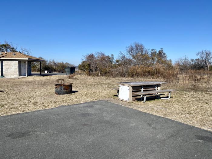 Bayside site A7 in February.  View from back-in drive-in site.  Picnic table, fire ring, and bathrooms in view.Bayside A7 - February