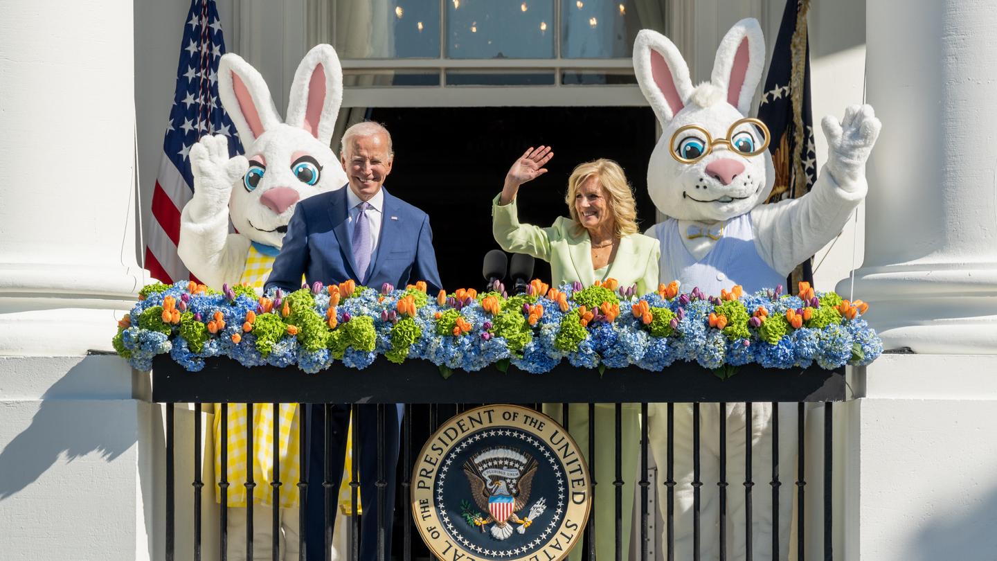 The President and the First Lady waving to  guests during the White House Easter Egg Roll
