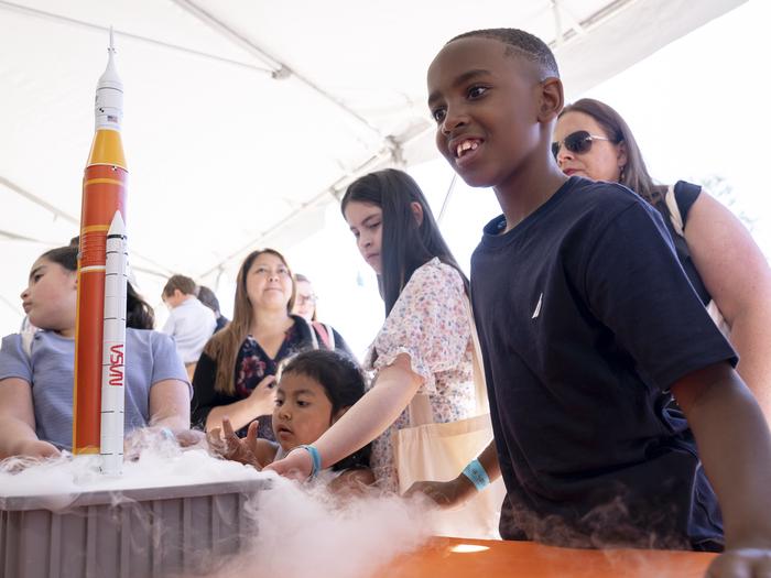 A child enjoying a model spacecraft as part of STEM activities with NASA.A child enjoying a model spacecraft as part of STEM activities with NASA during the White House Easter Egg Roll