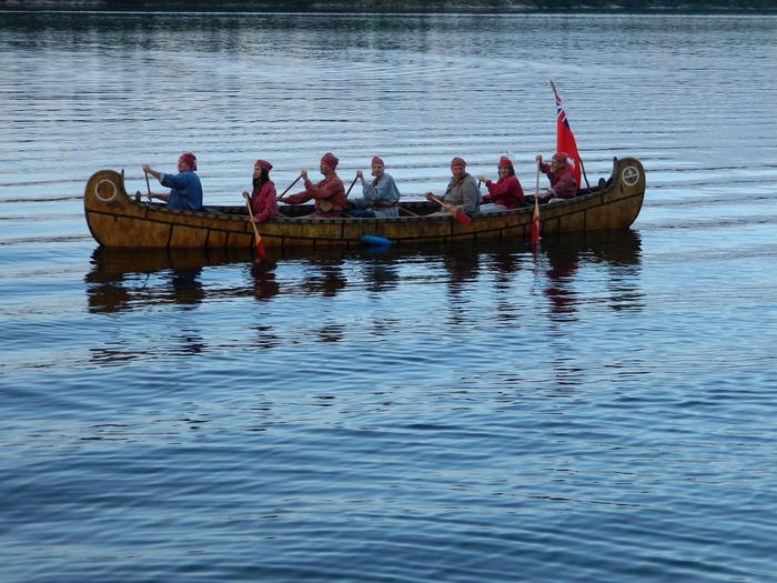 Visitors paddle a 26-foot replica of a birch bark north canoe on Rainy Lake.Visitors paddle a 26-foot replica of a birch bark north canoe.