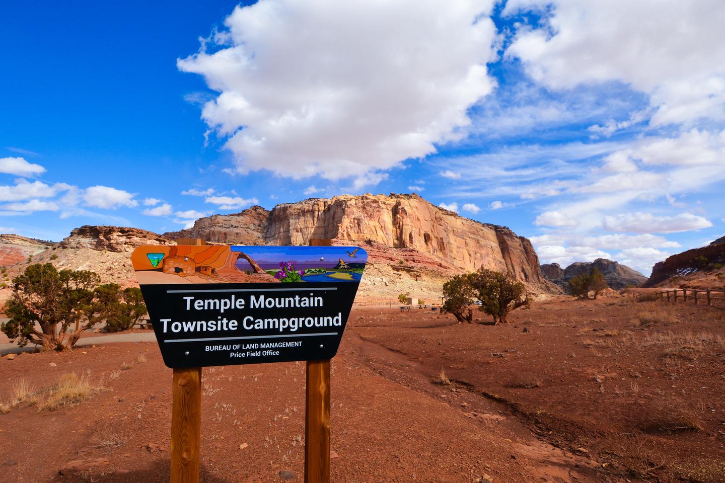 Sign for Temple Mountain Townsite Campground with a cliff in the backgroundCampground entrance.