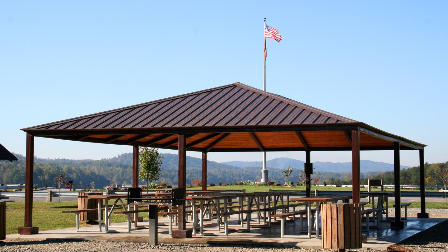 Fish Dam Creek Shelter has a wonderful view of the lake and dam. Staff photo of shelter with flagpole in background. 
