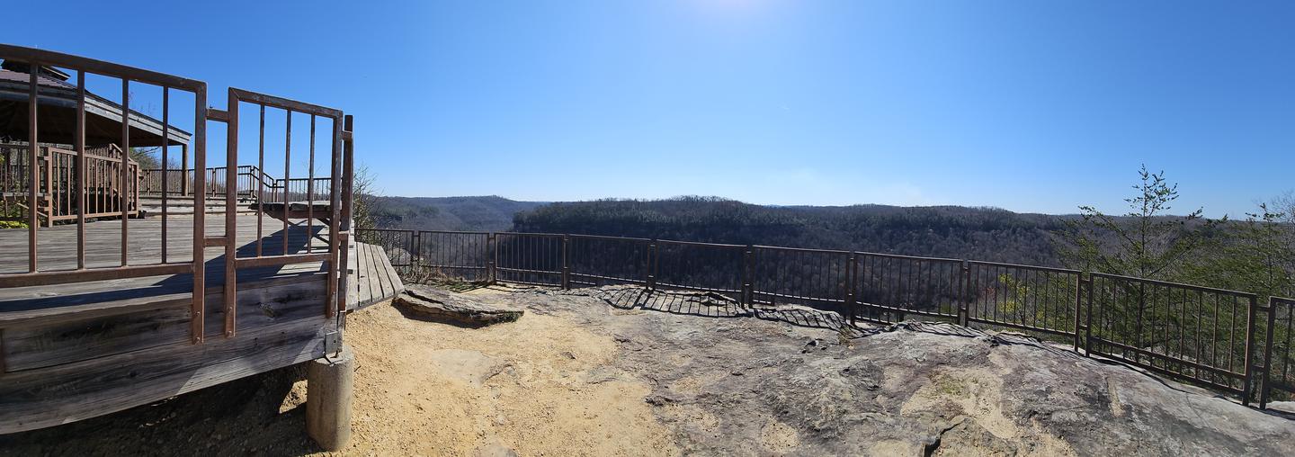 Blue skies above the rails of the overlook.The lower level in front of the Blue Heron Overlook and Gazebo.