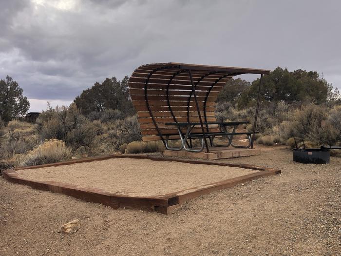 Tent pad, picnic table, and fire ring at Site 11