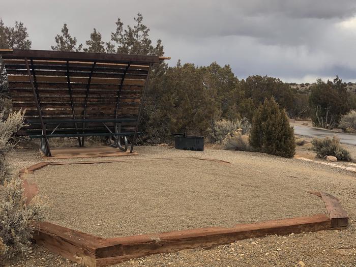 Tent pad, picnic table, and fire ring at Site 12