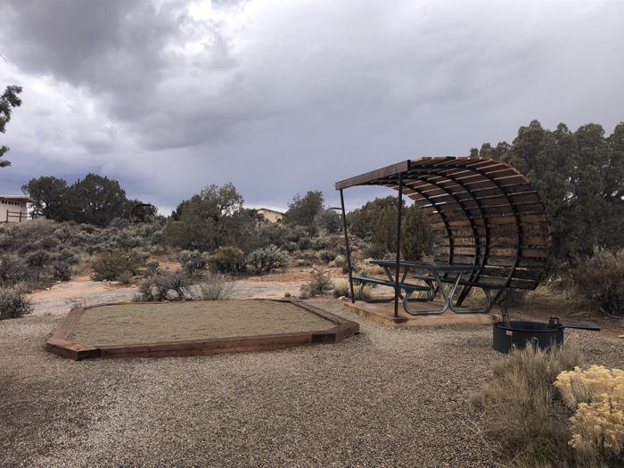 Tent pad, picnic table, and fire ring at Site 14