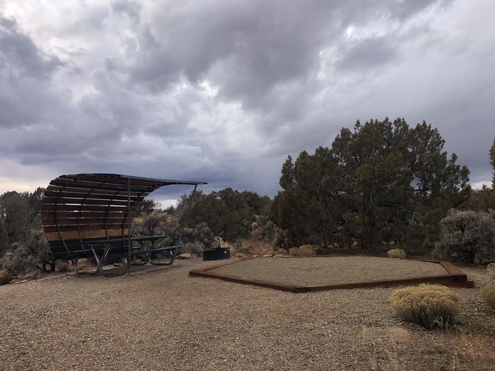 Tent pad, picnic table, and fire ring at Site 16