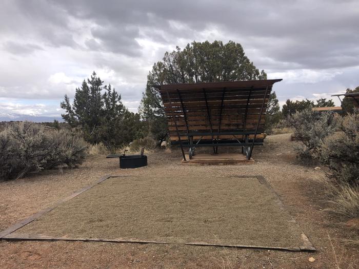 Tent pad, picnic table, and fire ring at Site 18