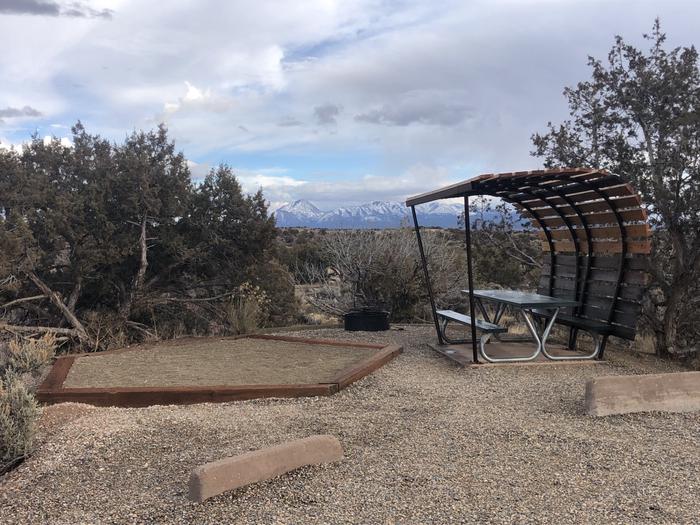 Tent pad, picnic table, and fire ring at Site 27