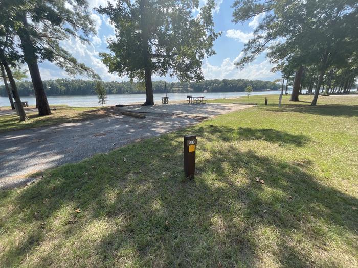 A photo of Site 088 of Loop CVIE at WHITE OAK (CREEK) CAMPGROUND with Boat Ramp, Picnic Table, Electricity Hookup, Sewer Hookup, Fire Pit, Shade, Tent Pad, Full Hookup, Waterfront, Lantern Pole, Water Hookup
