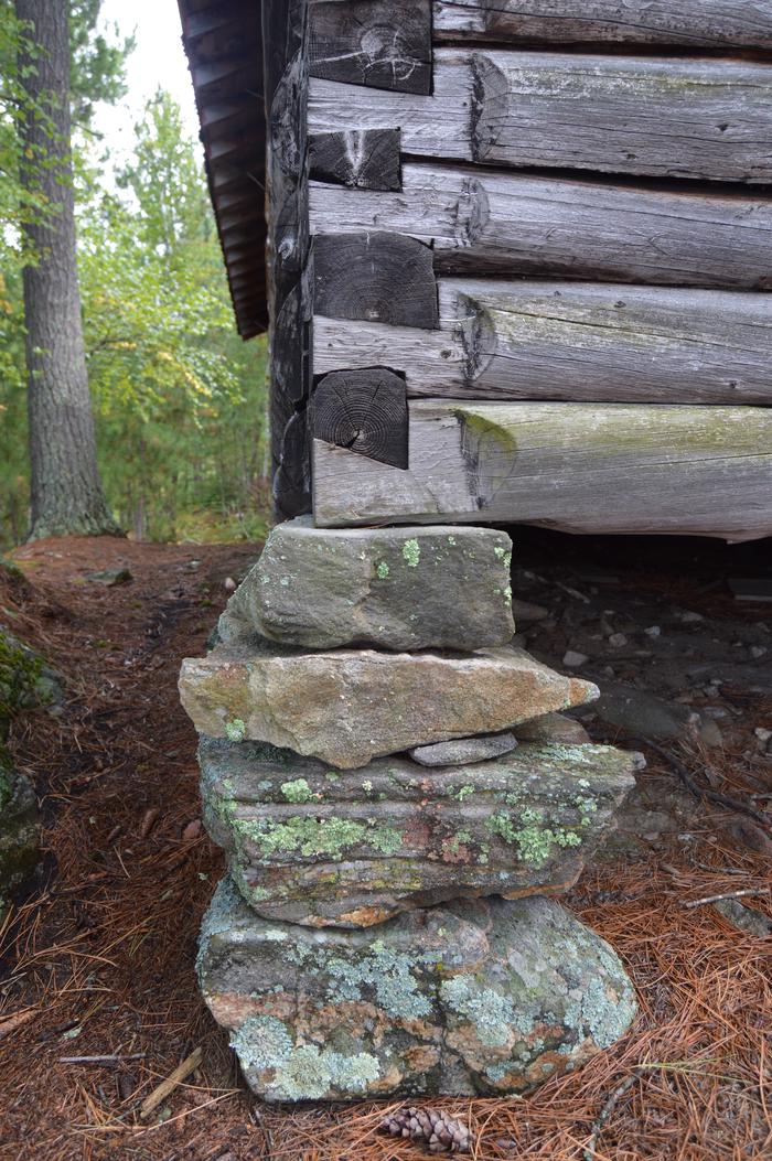 Unique dove-tail notching of logs that were cut by hand when built by IW Stevens, sitting atop dry-stacked rock pilings