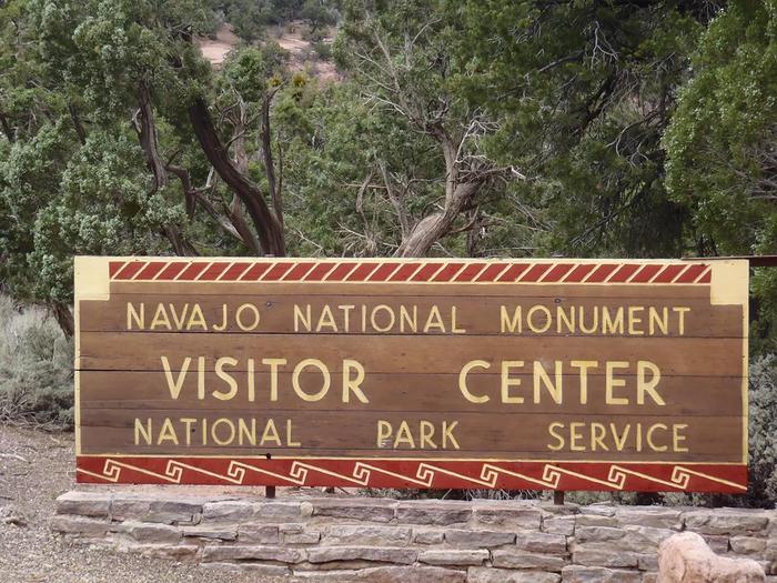 Visitor Center Sign at Navajo National MonumentThe visitor center has park information, a store that offers books, jewelry and souvenirs, a museum with artifacts, and an auditorium where park films are played upon request.