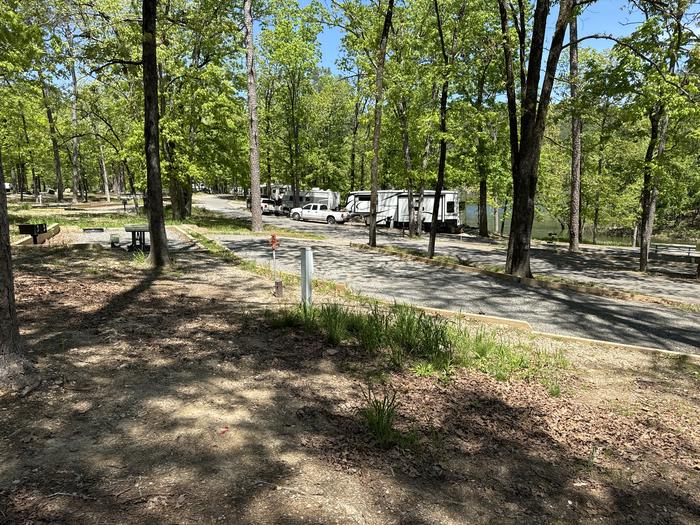 A photo of Site 04 of Loop A at Crystal Springs (AR) with Picnic Table, Electricity Hookup, Fire Pit, Water Hookup