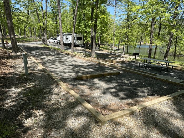 A photo of Site 05 of Loop A at Crystal Springs (AR) with Picnic Table, Electricity Hookup, Fire Pit, Waterfront