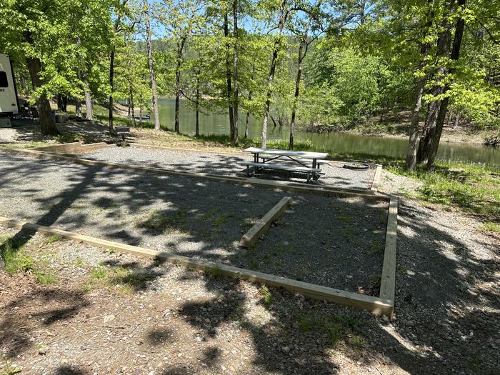 A photo of Site 06 of Loop A at Crystal Springs (AR) with Picnic Table, Fire Pit, Waterfront