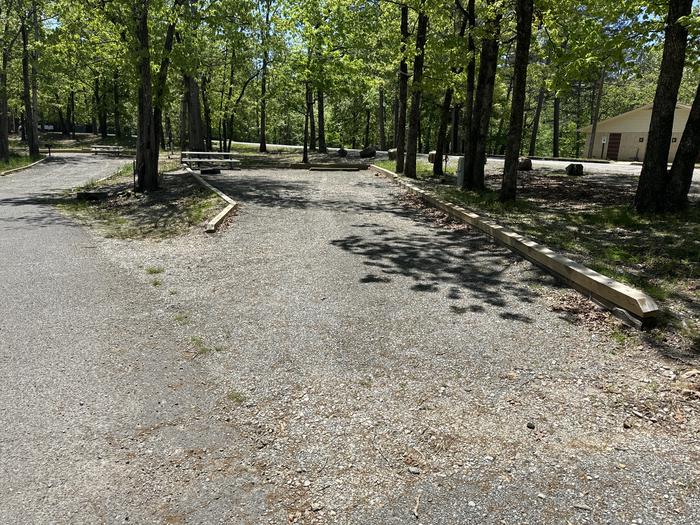A photo of Site 10 of Loop A at Crystal Springs (AR) with Picnic Table, Electricity Hookup, Fire Pit, Water Hookup